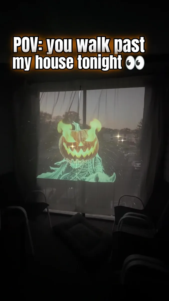 Headless Horseman rear projection glowing in a real house window at night